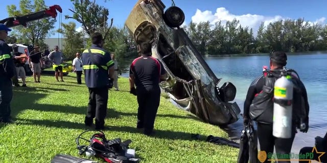 submerged car being pulled out of lake