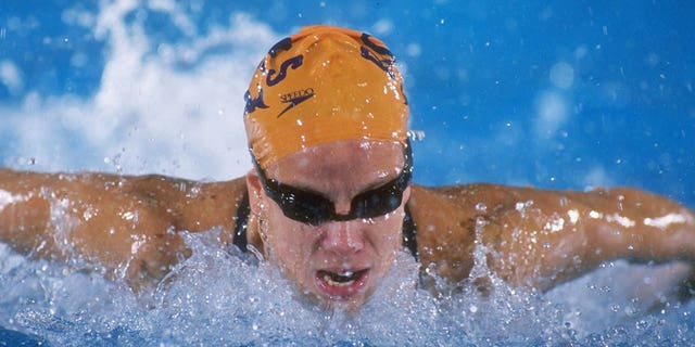 Jamie Cail swims in a competition.