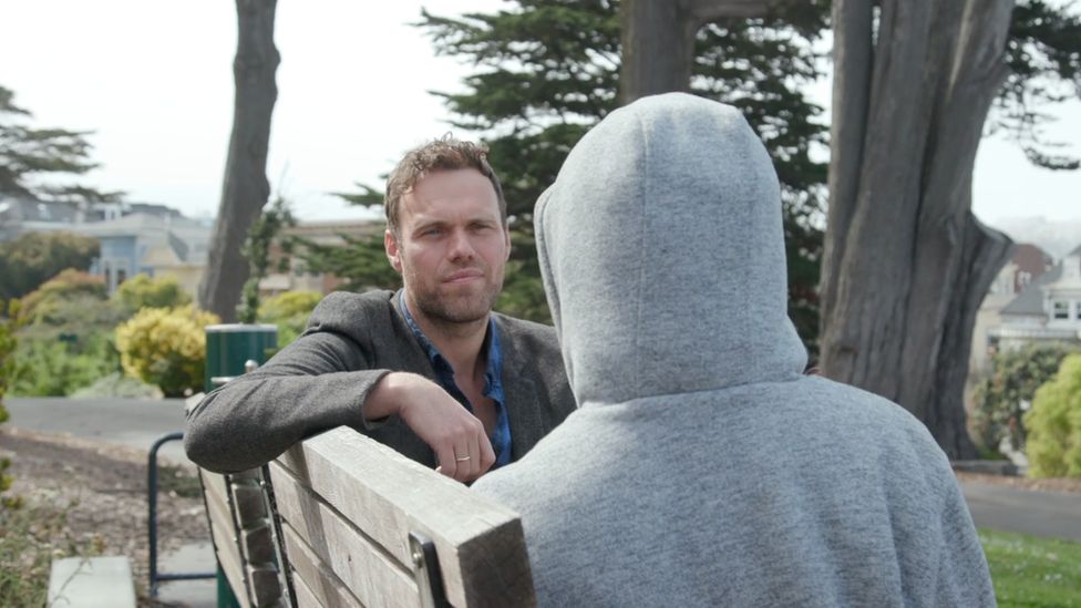 The BBC's James Clayton speaking to a representative of Safe Street Rebel