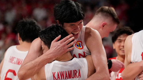 Japan's Yuta Watanabe and Yuki Kawamura celebrate beating Finland in the basketball World Cup in Okinawa on  August 27, 2023. 