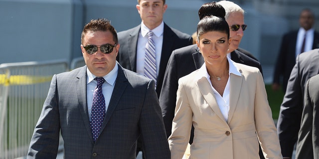 Joe and Teresa Giudice walking out of court