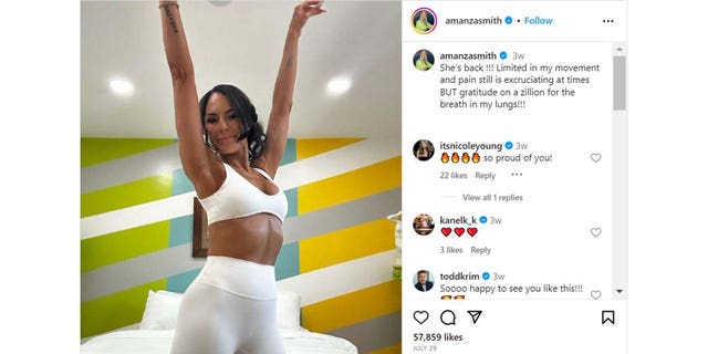 Amanza Smith raising her arms in victory on Instagram
