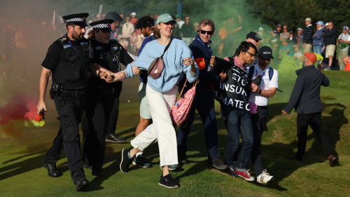 TADWORTH, ENGLAND - AUGUST 13: Protestors make their way onto the 17th green on Day Four of the AIG Women's Open at Walton Heath Golf Club on August 13, 2023 in Tadworth, England. (Photo by Andrew Redington/Getty Images)