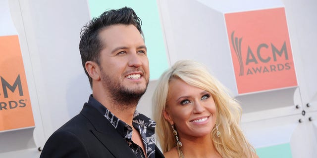 Luke Bryan poses for a photo with wife Caroline Boyer