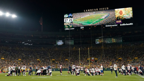 Members of the New England Patriots kneel on the field as teammate Isaiah Bolden #7 is attended to after being injured during a preseason game at Lambeau Field in Green Bay, Wisconsin, on Saturday. 