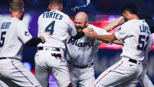 MIAMI, FLORIDA - AUGUST 13: Jake Burger #36 of the Miami Marlins celebrates with teammates after walking it off to defeat the New York Yankees at loanDepot park on August 13, 2023 in Miami, Florida. (Photo by Megan Briggs/Getty Images)