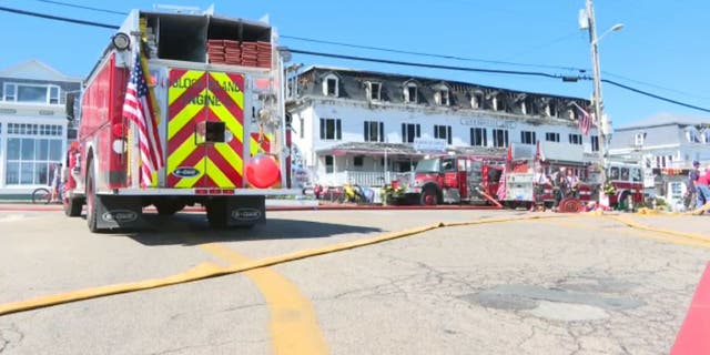 Fire truck next to damaged hotel