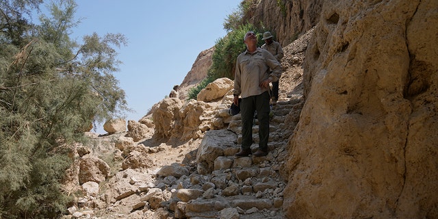 A photo of rocks, a trail