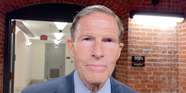 Sen. Richard Blumenthal interviewing in a senate basement hallway