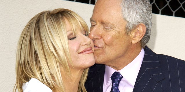 Alan Hamel kisses Suzanne Somers