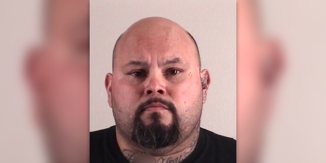 Javier Arredondo has a bald head and goatee in his mug shot