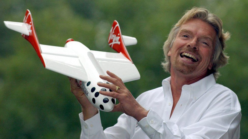 Sir Richard poses with a model of the Virgin spaceship in 2004, after announcing his intention to offer space flights to paying passengers