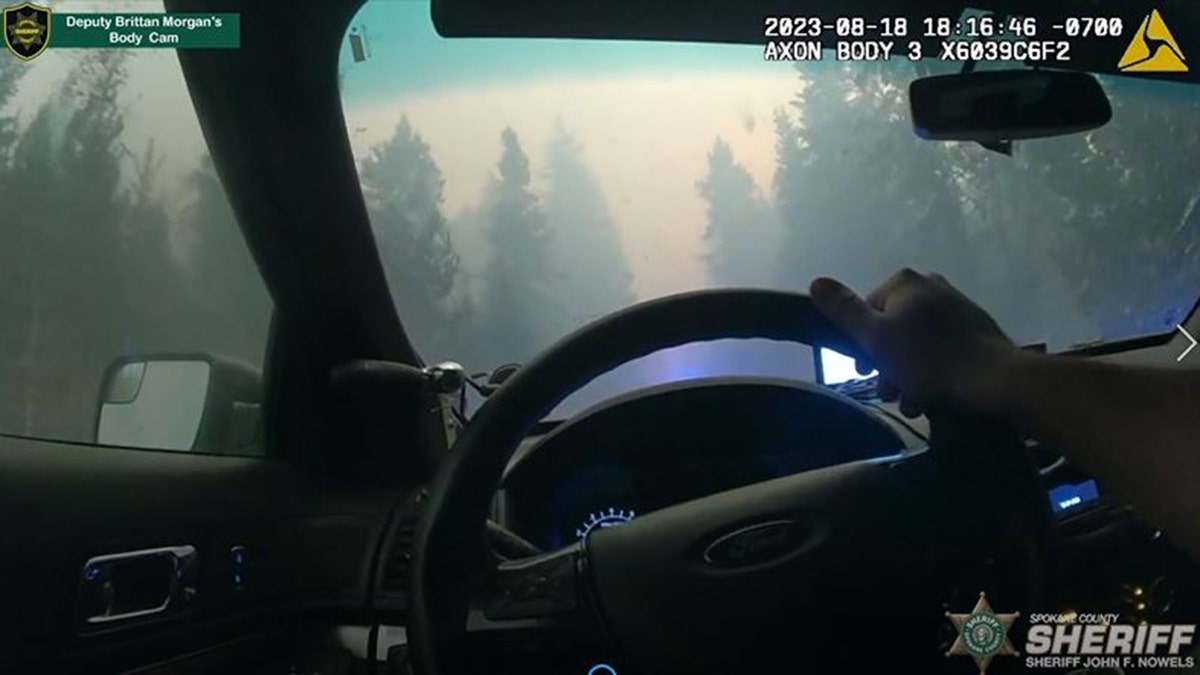 Spokane deputy drives through fire two