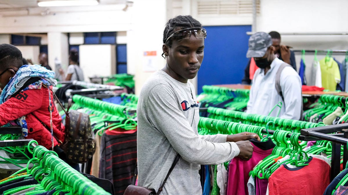 man shopping at clothing stores