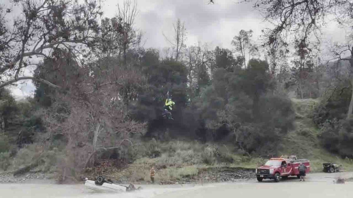 woman hoisted to safety