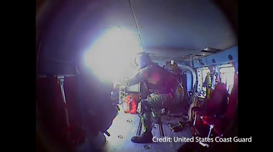 Watch U.S. Coast Guard make daring rescue of couple and dog