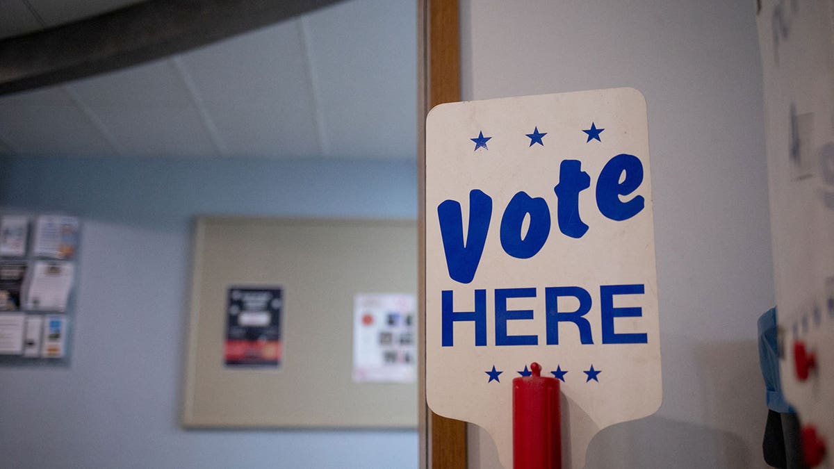 "Vote here" sign 