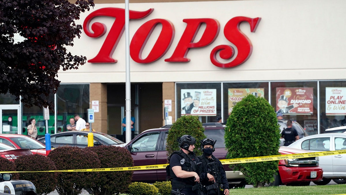 Tops supermarket shooting scene with armed police outside