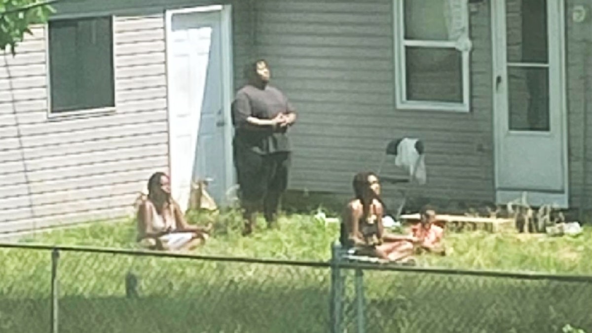 Missing Missouri group meditating in their St. Louis yard