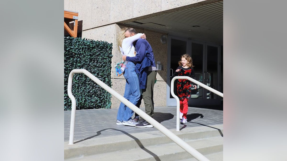 Lt. Ridge Alkonis greets his family in Los Angeles