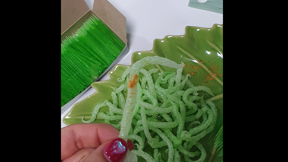 Person holding fried toothpick