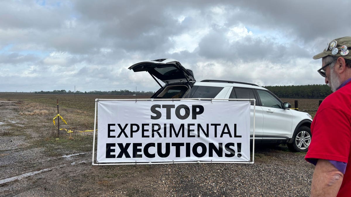 A sign reads "stop experimental executions!"