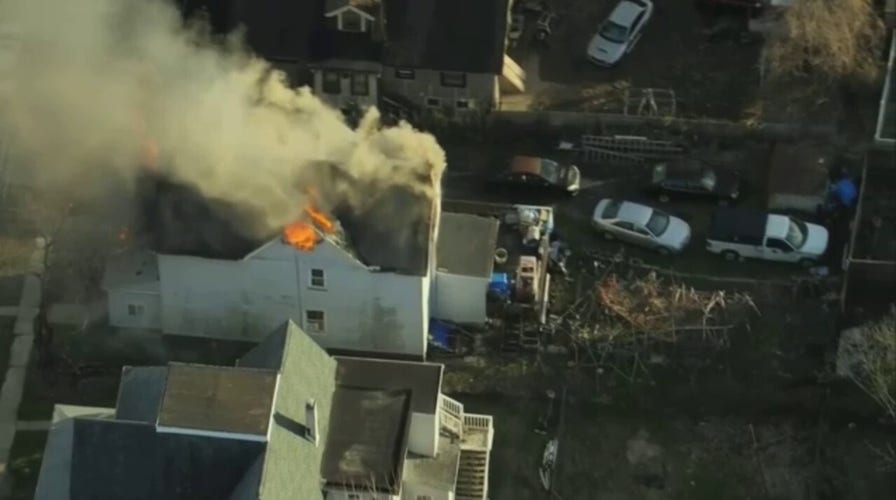 Police in Philadelphia suburb respond to possible officer shooting near house fire