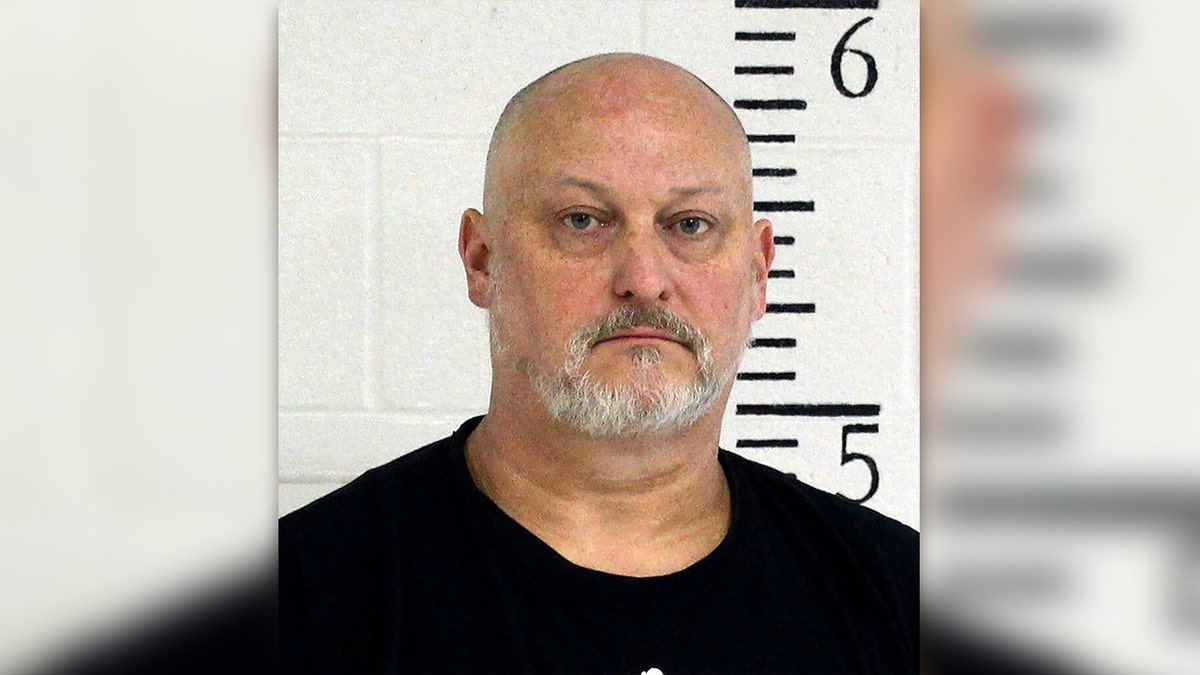 Shawn C. Cranston with bald head and short beard in mugshot