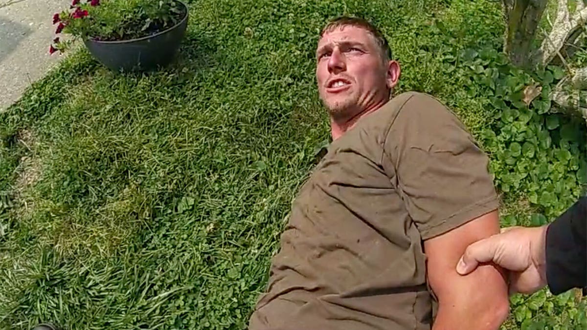 Ohio dad Chad Doerman handcuffed on the ground