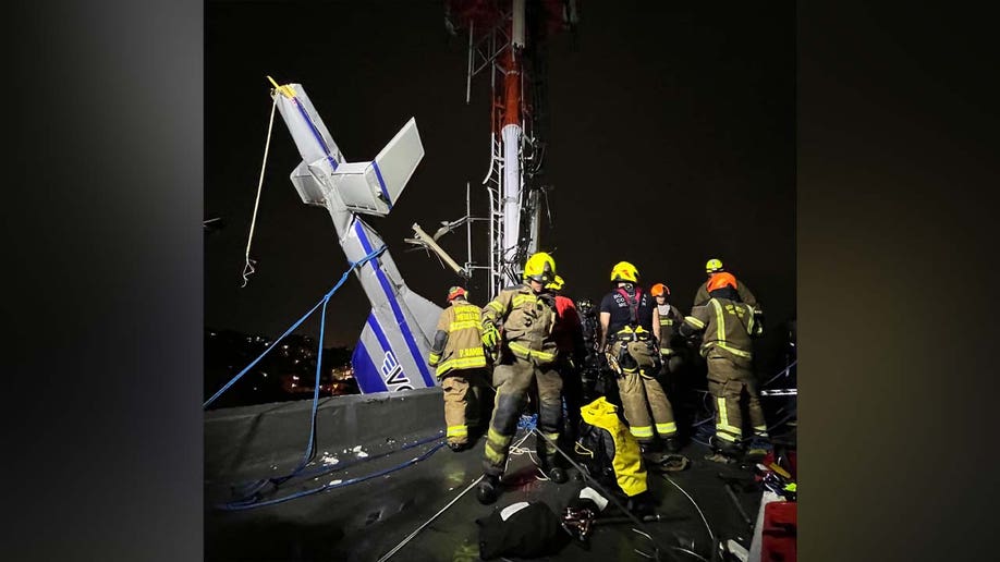 Emergency personnel helping helicopter