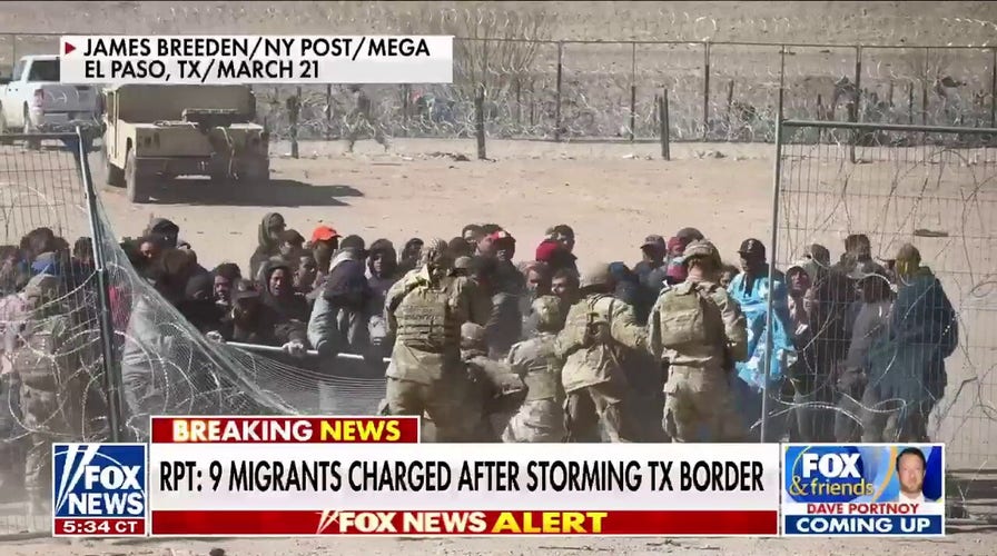 9 migrants charged with assault, inciting riot after storming border