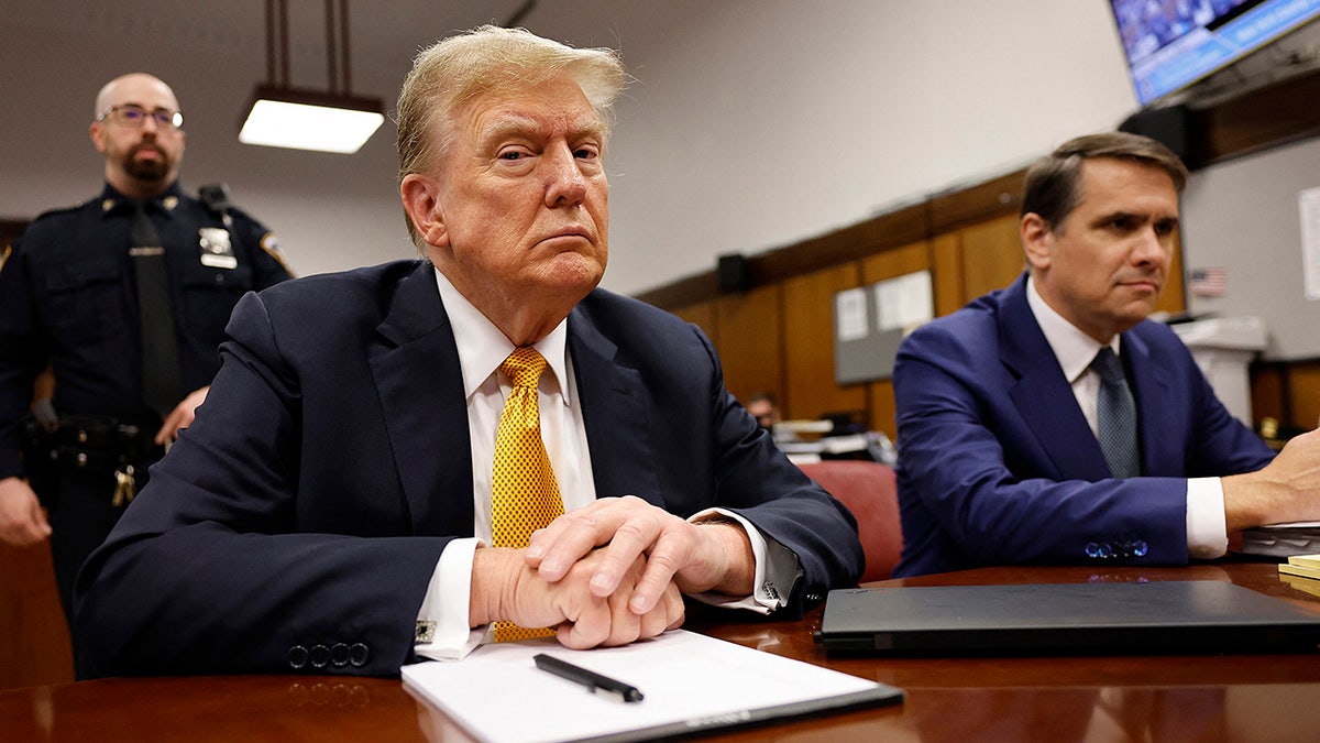 Donald Trump at defense table in courtroom