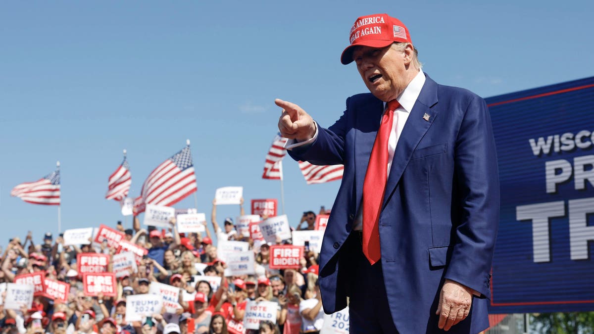 Former President Donald Trump, the presumptive GOP presidential nominee, walks to the podium at a campaign event Tuesday, June 18, 2024, in Racine, Wis. (AP Photo/Jeffrey Phelps)