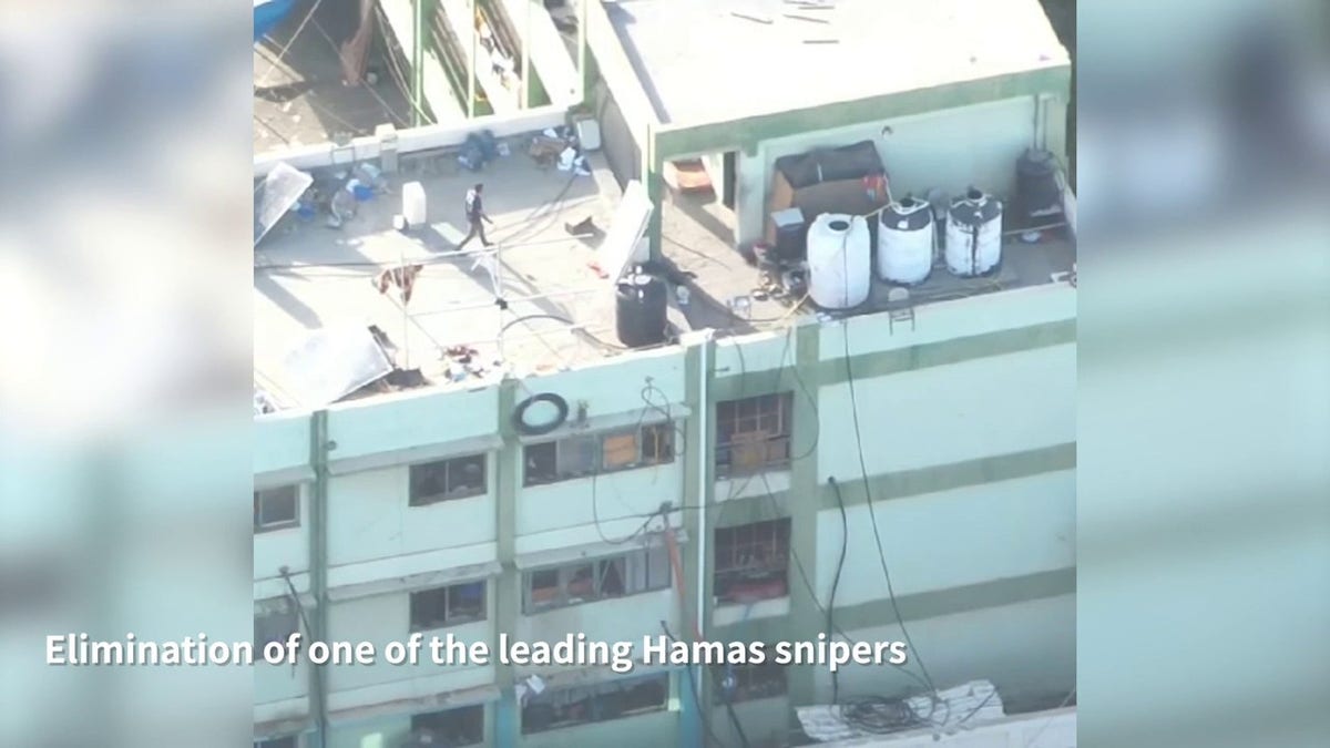 Hamas commander walking on roof before strike