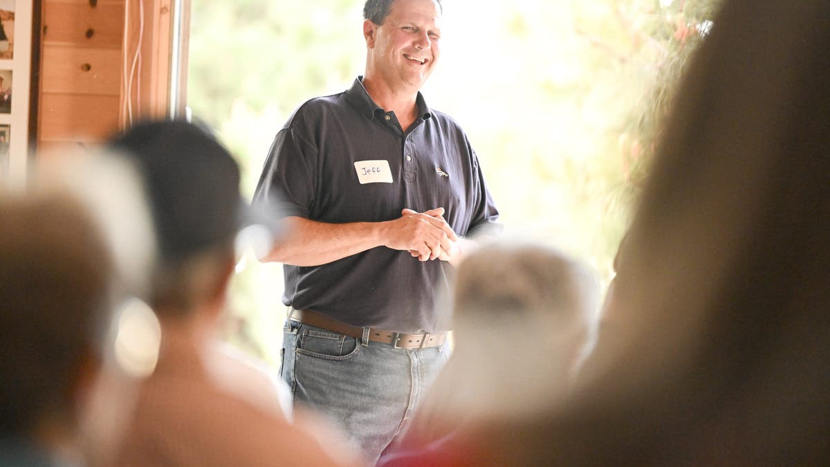 Jeff Crank speaking to campaign audience indoors