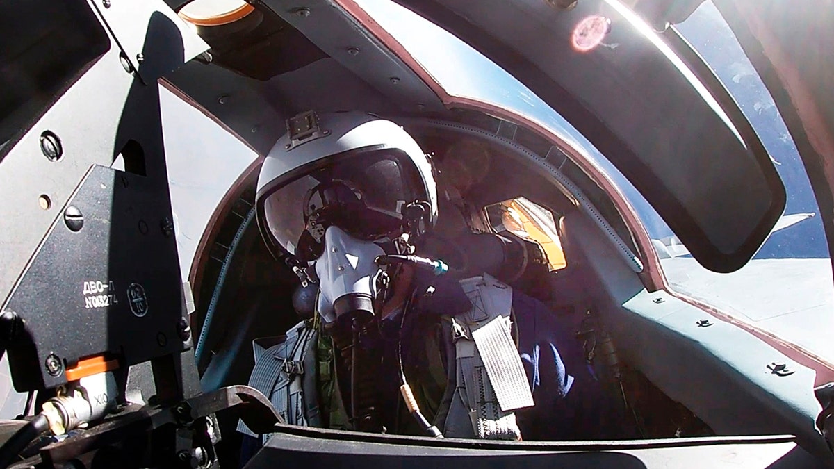 A pilot sits in a cockpit of a MiG-31 fighter jet of the Russian air force during joint Russian-Belarusian drills.