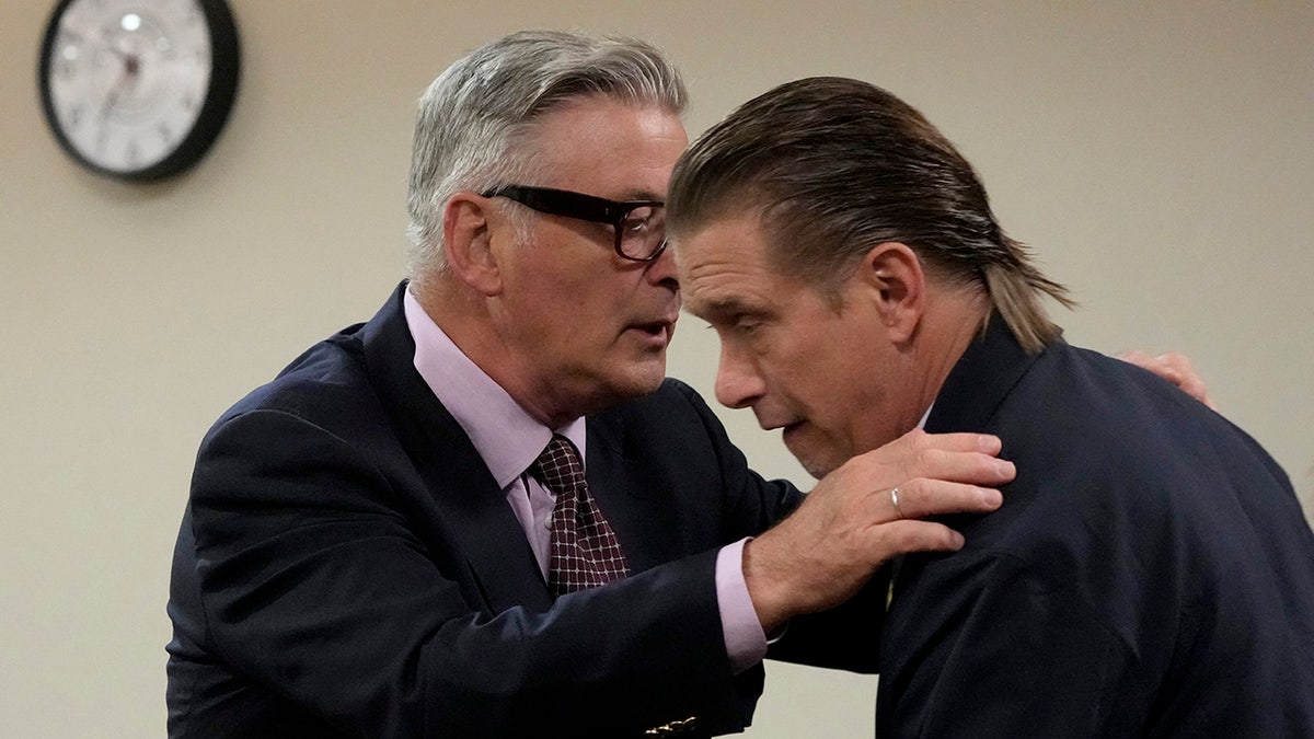 Alec Baldwin reaching for brother Stephen Baldwin during Rust trial