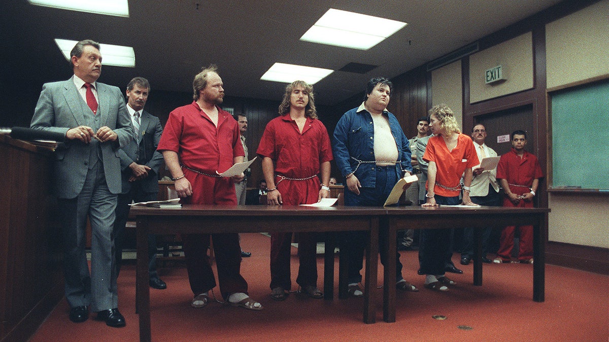 Members of The Cause lined up in court with attorneys.