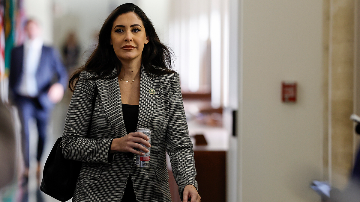 Rep. Luna walking down hallway