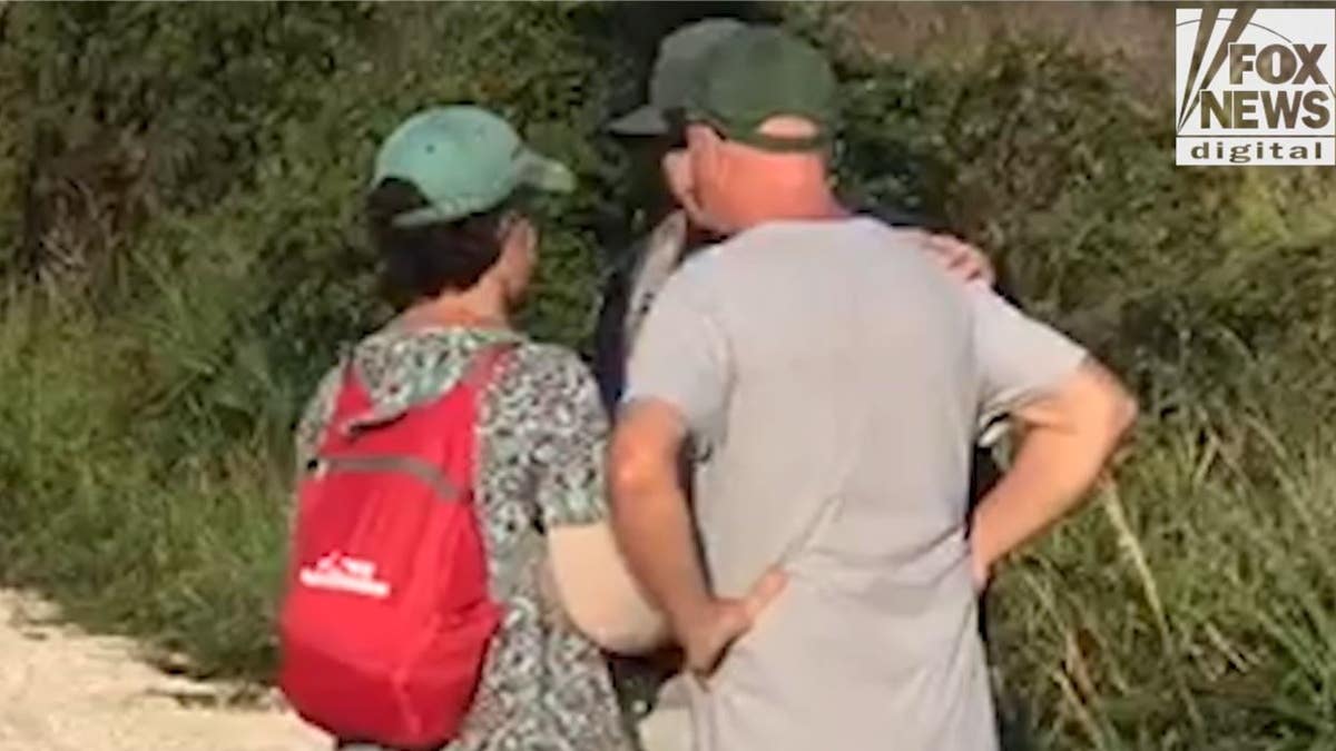 A North Port detective speaks with Chris and Roberta Laundrie at Myakkahatchee