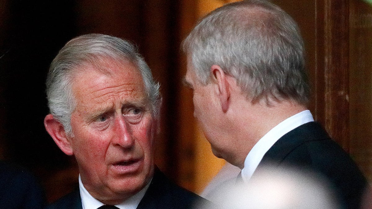 King Charles talking sternly to Prince Andrew