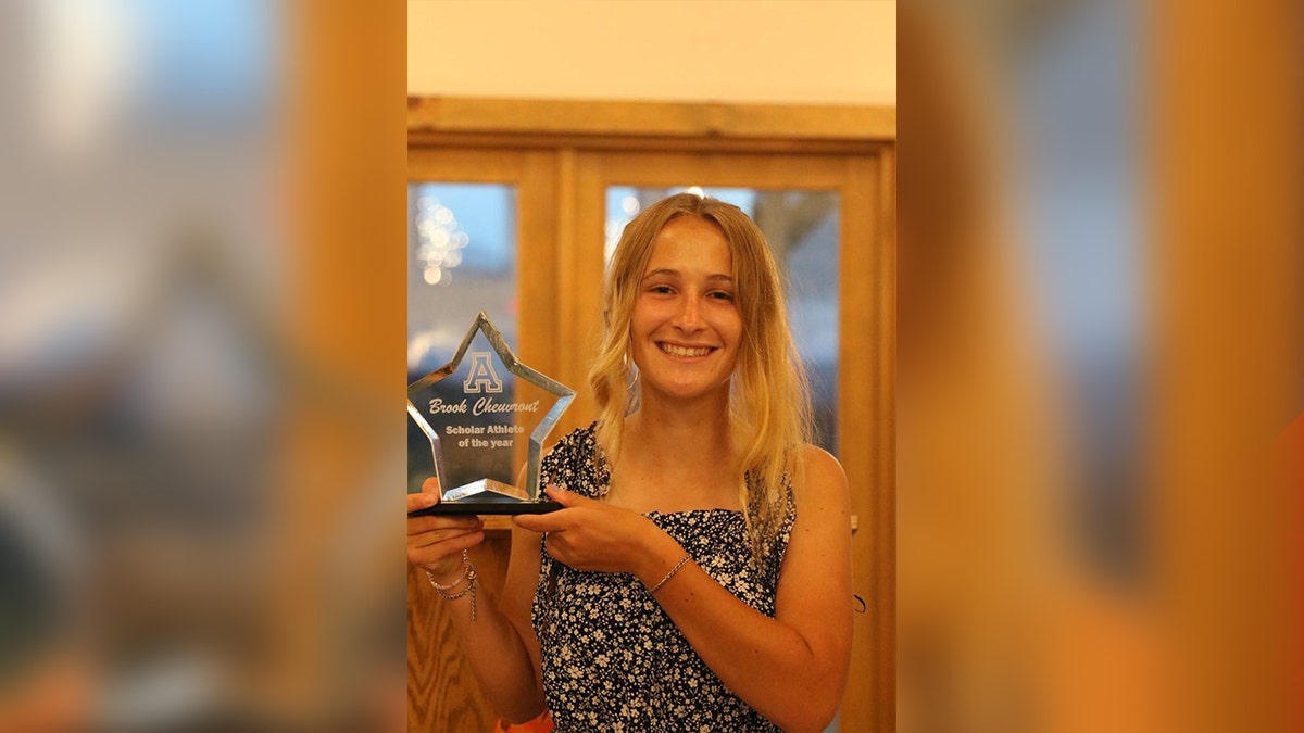 Brook Cheuvront holds scholar athlete of the year award