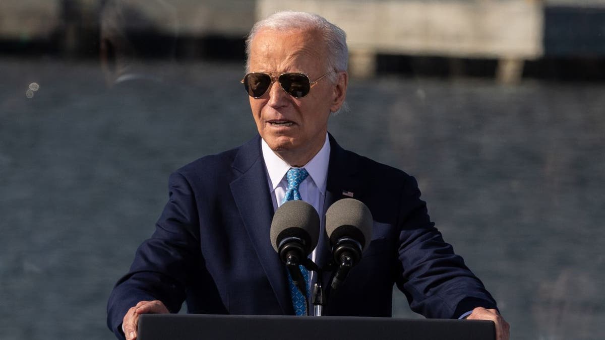 President Joe Biden wearing sunglasses speaking