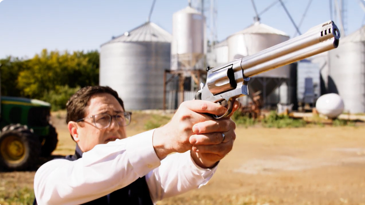 Rep. Mike Flood holding a gun