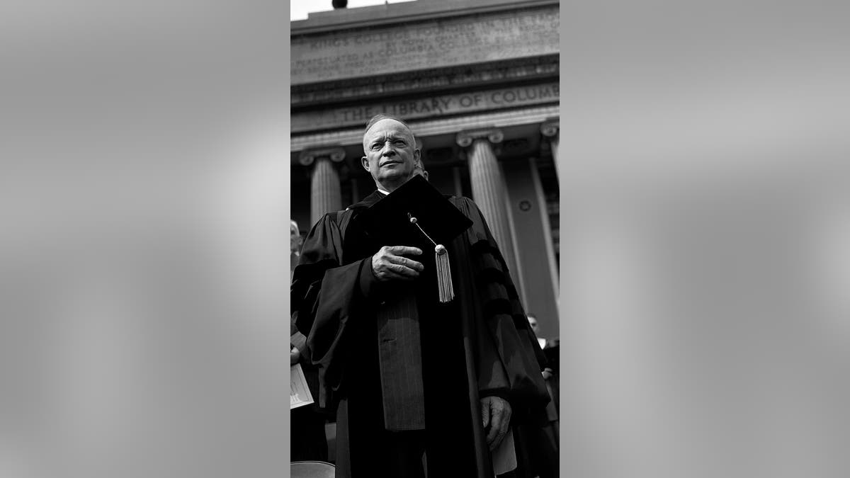 Dwight D. Eisenhower poses for a portrait in his cap and gown before his Inauguration to become President of Columbia University