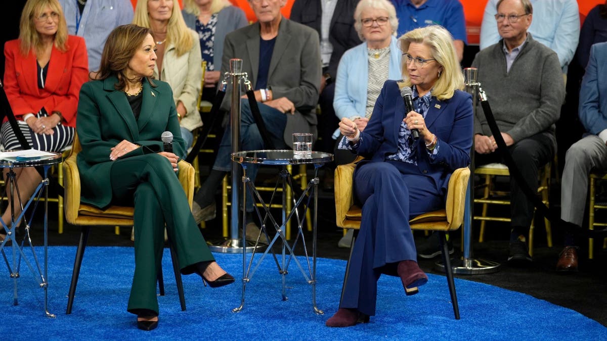 Democratic presidential nominee Vice President Kamala Harris listens as former Republican Rep. Liz Cheney speaks during a town hall at The People's Light in Malvern, Pa., Monday, Oct. 21, 2024.