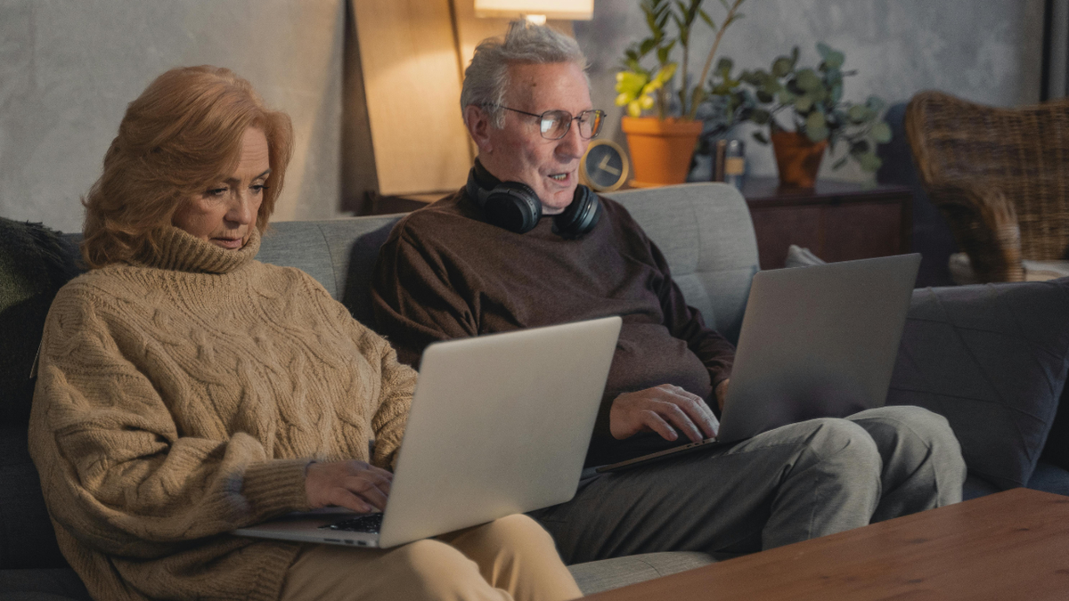 couple on laptops