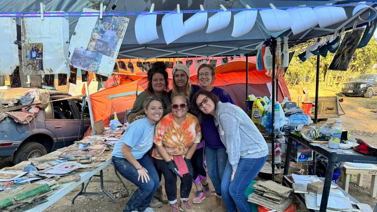 Dara Cody poses with volunteers from Emerge Ministries