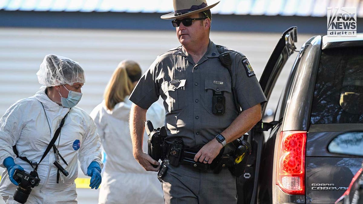 New York State Police collect evidence at the home of Craig Ross Jr.