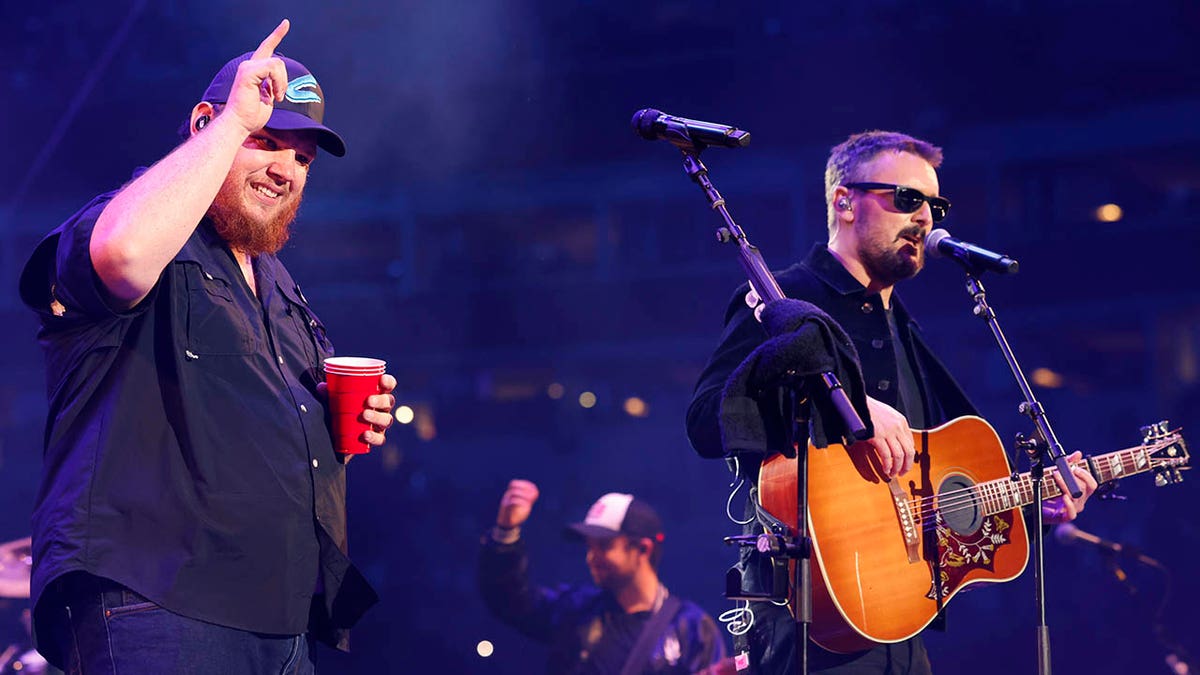 eric church and luke combs at concert